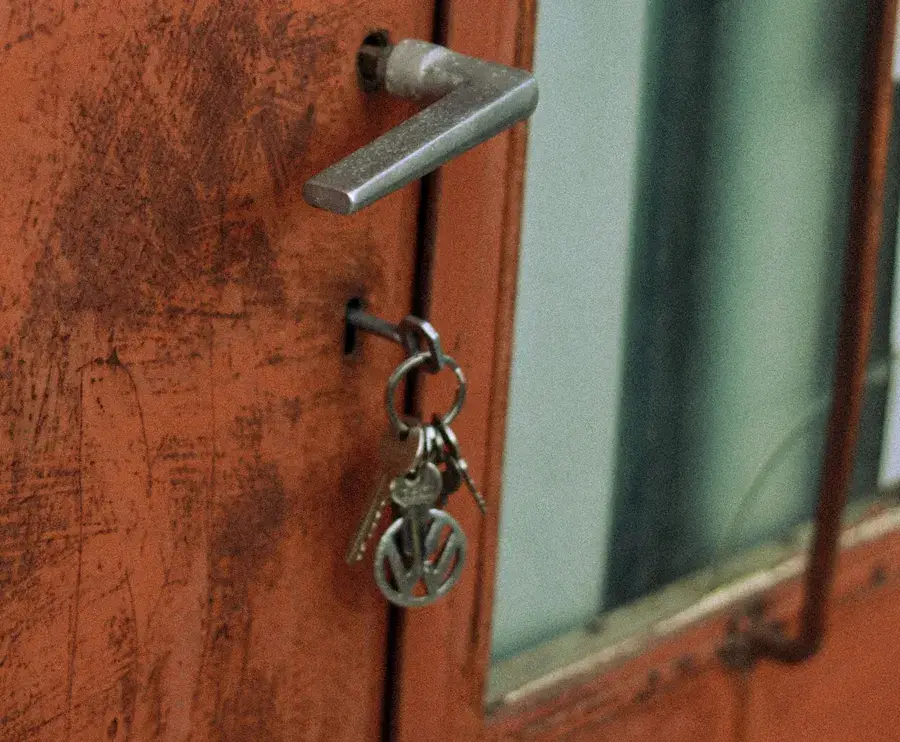 Keys hanging from the lock of an old door – why keys snap and when broken key removal Birmingham is needed, Locksmith Birmingham