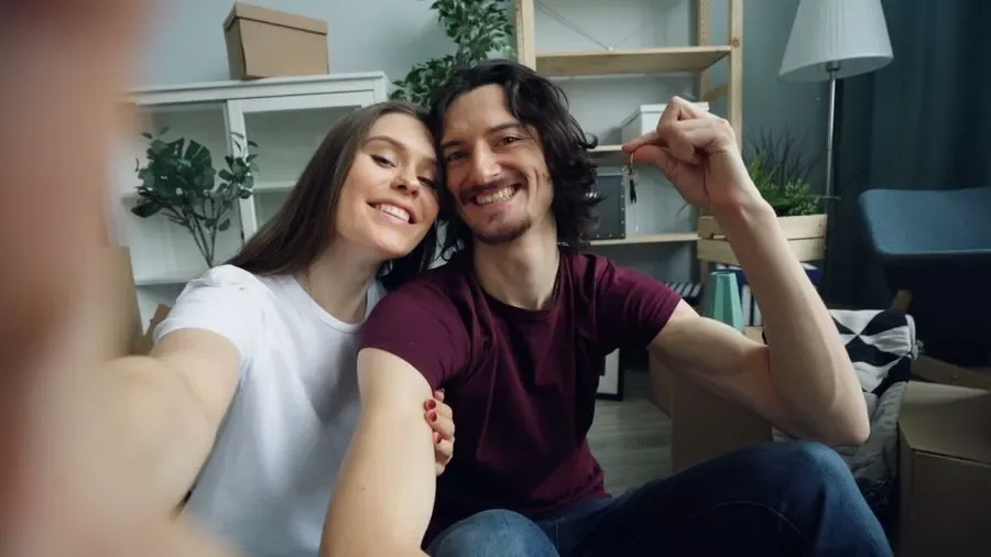 Couple holding up keys in their new home – residential locksmith Birmingham help for homeowners from Locksmith Birmingham