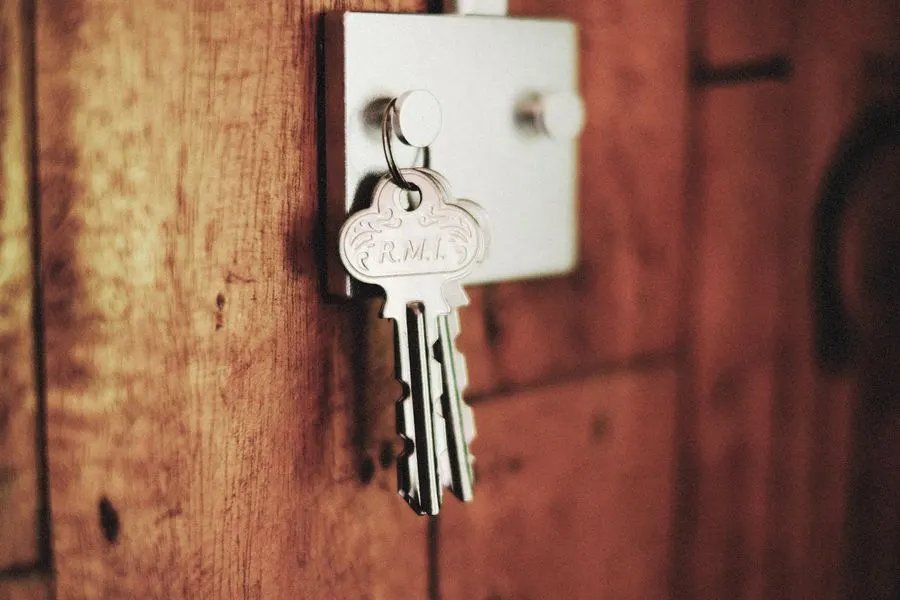 Key in the lock of a wooden door